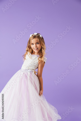 Full length portrait of a smiling cheerful pretty girl