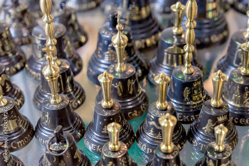 Metal decorative bells with a gold handle.