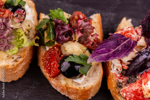 Bruschetta with olives and a basil
