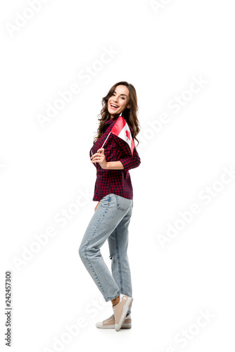 attractive woman holding canadian flag and looking at camera isolated on white © LIGHTFIELD STUDIOS