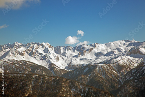 snowy mountain peaks against the blue sky