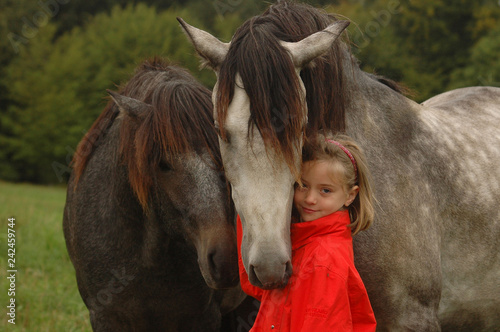 Little girl with foals