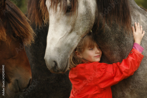 Little girl with foals