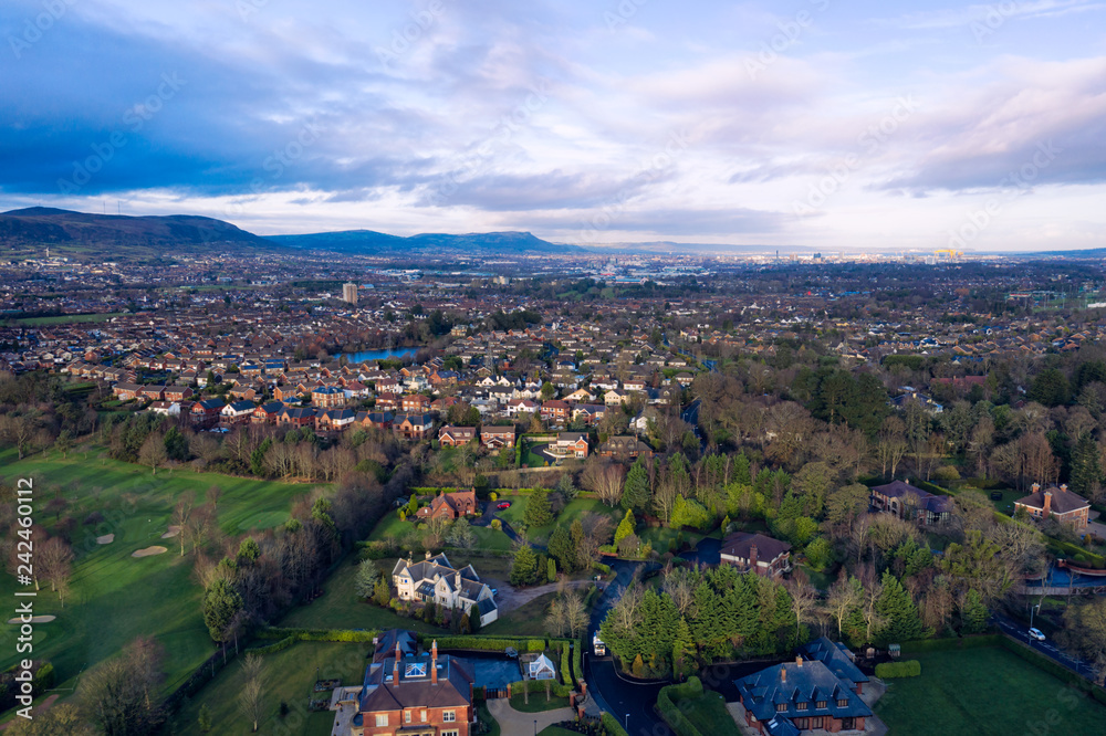 aerial view of  Autumn countryside to the city during  sunset time, Northern Ireland