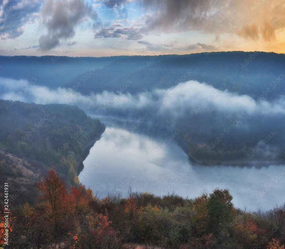 foggy canyon of a picturesque river. foggy autumn morning