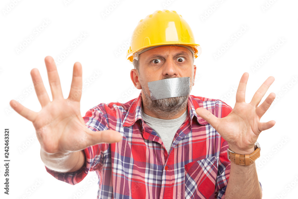 Constructor making stay away gesture with hands. Constructor making stay away gesture with hands.