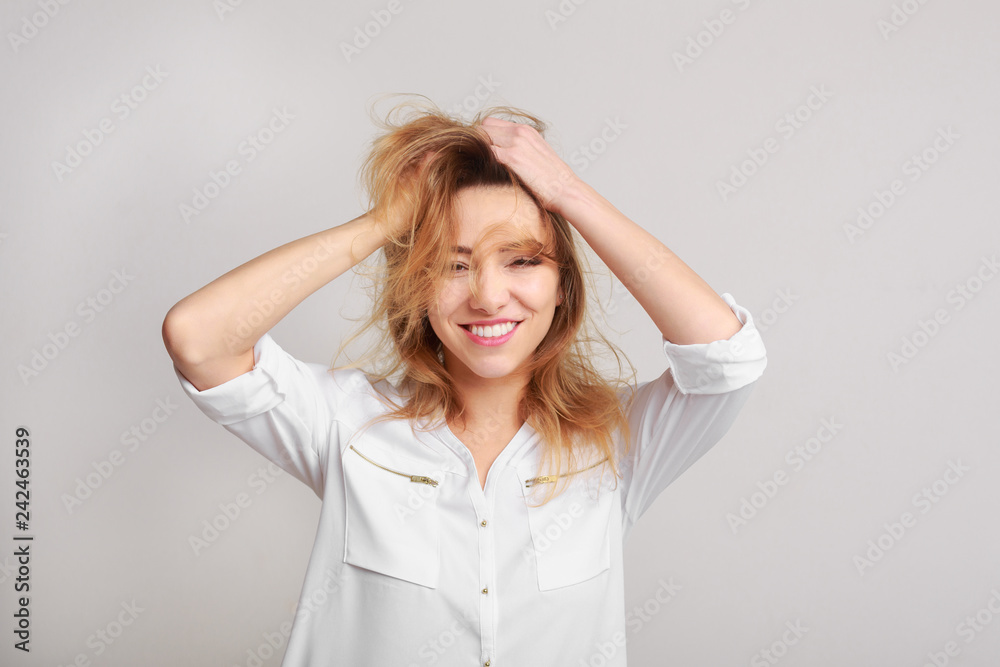 Enjoy life to fullest. Woman playing with her hair Enjoy life to fullest. Woman playing with her hair
