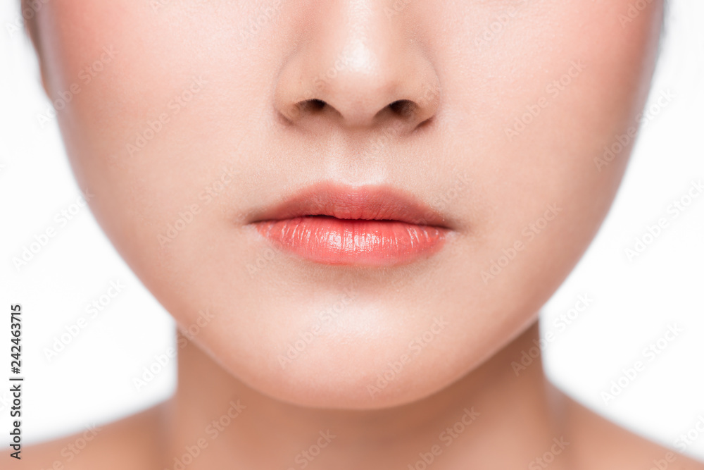 Young asian woman close up. Perfect natural lip makeup Young asian woman close up. Perfect natural lip makeup