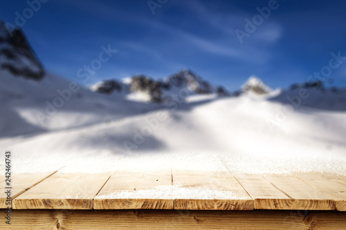 Wooden desk space and mountains landscape  © magdal3na