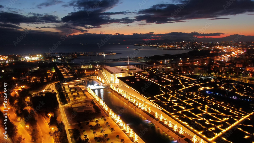 Aerial drone night shot of iconic public settlement of illuminated Stavros Niarchos Foundation and cultural centre during Christmas time, Faliro, Attica, Greece