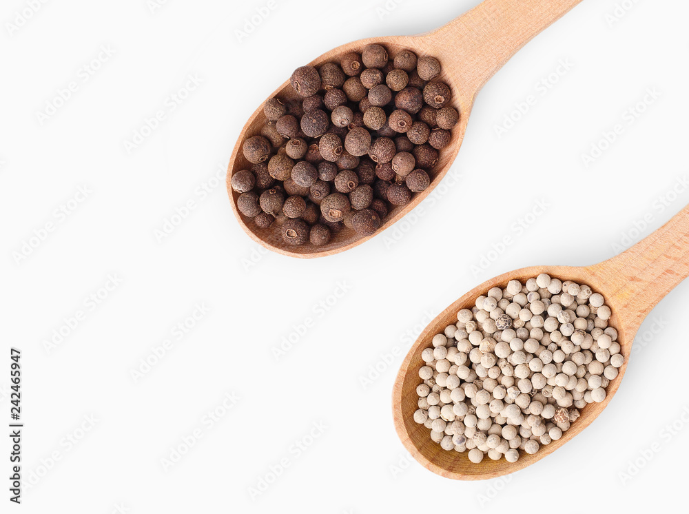 Wooden spoons with aromatic culinary condiments on white Wooden spoons with aromatic culinary condiments on white