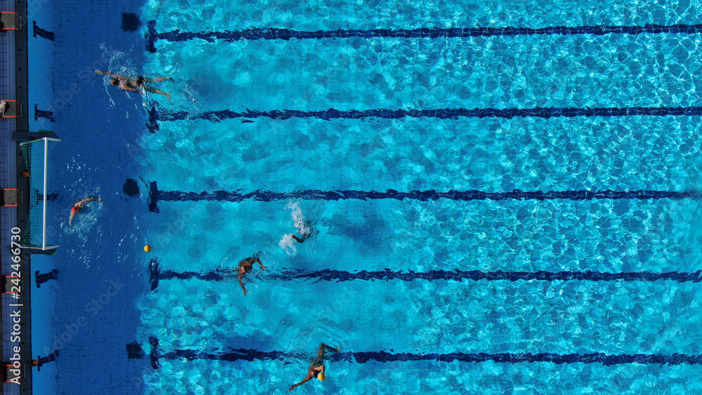 Aerial drone top view photo of people swimming in pool