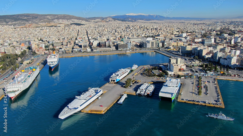Aerial drone photo of crowded port of Piraeus, one of the most large in Europe, where boats and cruise ships travel to popular Aegean destinations