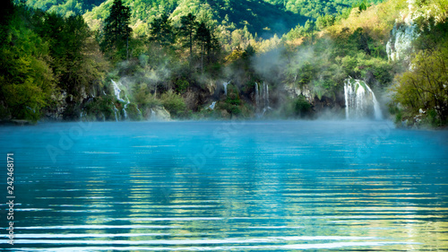 Misty Waterfall and Lake within the colorful Plitvice National Park in Croatia