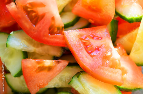 Fresh vegetable salad of tomatoes and cucumbers, the image is suitable for a healthy organic diet.