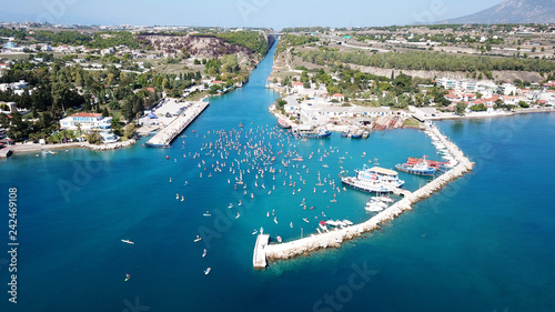 Aerial bird's eye view photo taken by drone of stand up paddle surfing or SUP competition in Corinth Canal of Isthmos or Isthmus, Peloponnese, Greece photo
