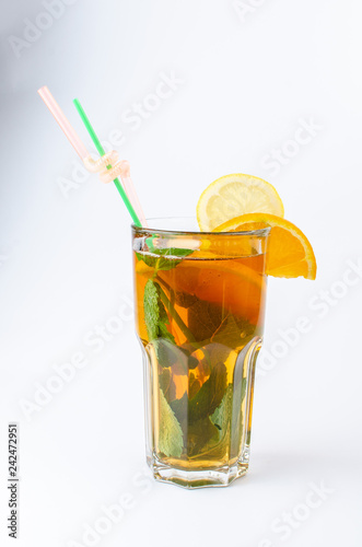 tea with honey, lemon, cinnamon and mint in a clear glass