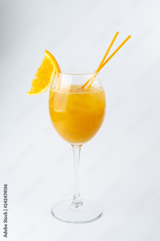 orange cocktail with orange slice on white background