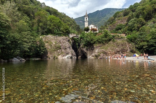 River Cannobino with bathing place at the end of the gorge of Sant' Anna, in the baclground the church of Orrido Sant' Anna, Cannobio, Verbano-Cusio-Ossola province, Piedmont region, Italy, Europe photo