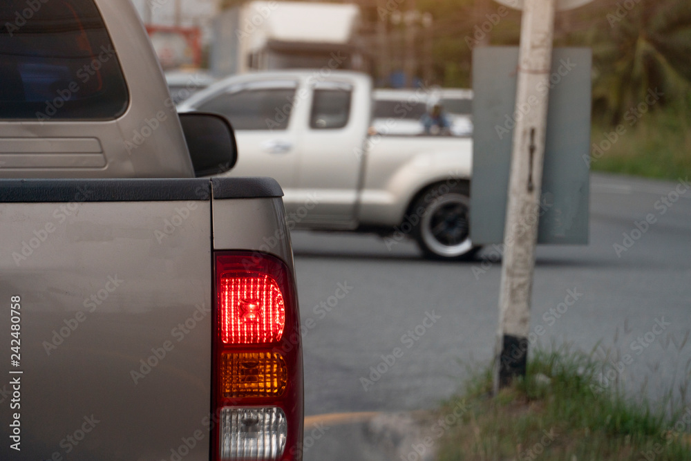 Brown car break on the road by traffic light control with cars cross the intersection at day. Brown car break on the road by traffic light control with cars cross the intersection at day.