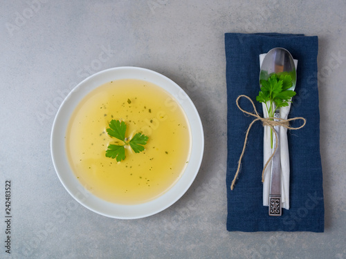 Fastenkur, Diät - Suppe in einem weißen Teller mit Petersilie, Draufsicht photo