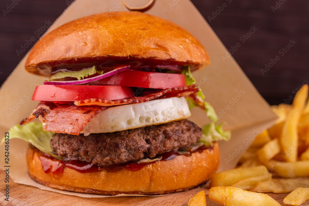 Hamburger with cutlet and bacon, grilled vegetables and tomato sauce Hamburger with cutlet and bacon, grilled vegetables and tomato sauce