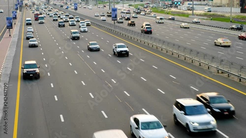 Cars run along widest Sheikh Zayed highway. High angle perspective, top view on driveway. Vehicle move on all lanes of the road. Real time shot