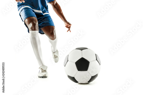 The legs of soccer player close-up isolated on white. African american model in action or movement with ball. The football, game, sport, player, athlete, competition concept © master1305