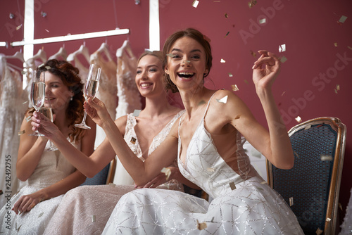 Close up of cheerful brides in wedding dresses