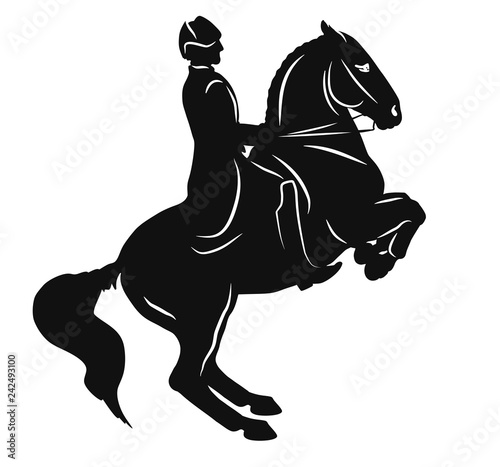 Higher school of riding. Silhouette of a horse and rider executing a levade.