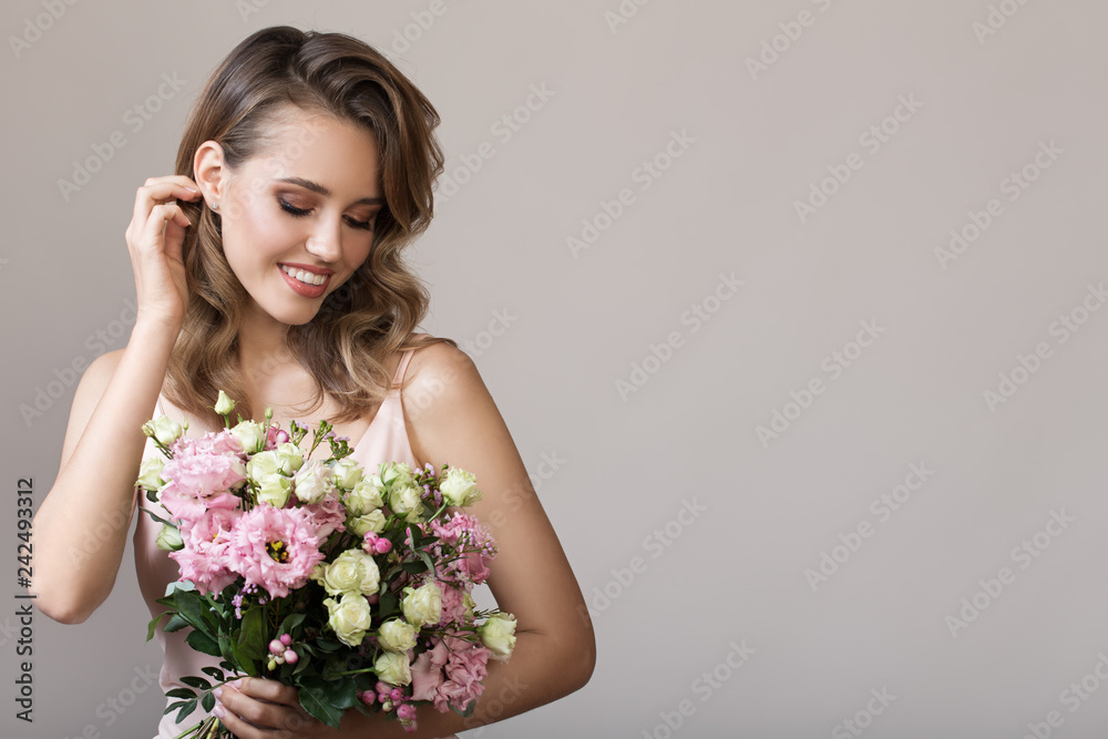 Portrait of beautiful smiling woman. Holding bouquet in hands. Portrait of beautiful smiling woman. Holding bouquet in hands.
