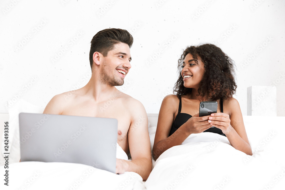 Beautiful happy young multiethnic couple relaxing Beautiful happy young multiethnic couple relaxing