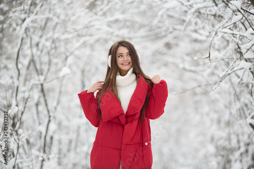 Portrait of cute happy woman outdoor. Winter forest.