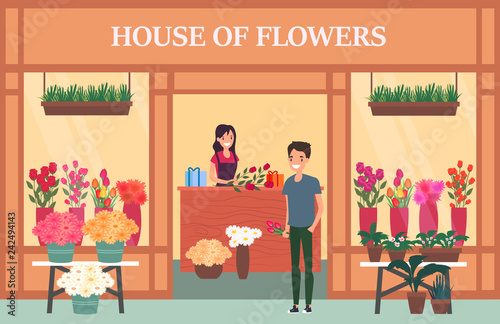 Woman seller at flower shop with bouquet