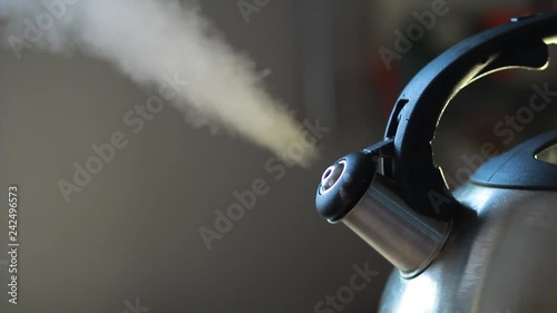 Kettle boiled with a whistle and steam photo