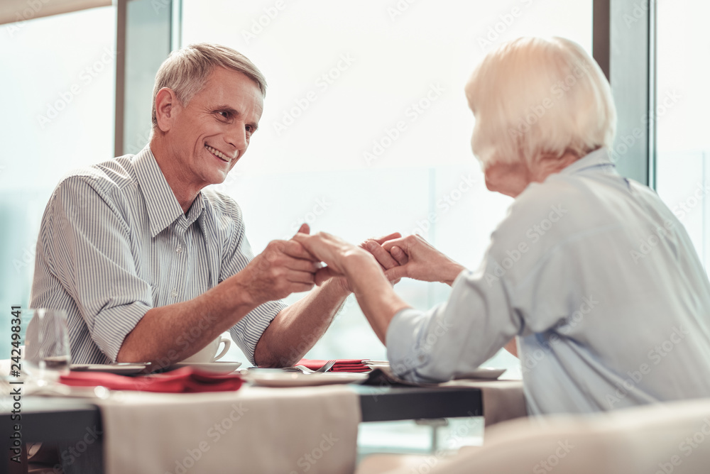 Smiling man and woman having great time together
