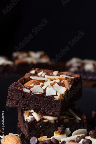 chocolate brownies with almond topping; selective focus