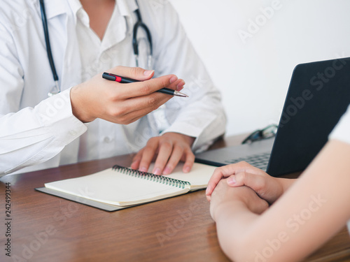 Doctor and Patient are talking in the hospital. Health care and Medical Concept. © Suriyawut