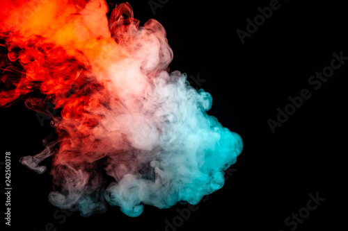 Multicolored illuminated smoke rolling from blue to red along substance molecules swirls on a dark background, depicting a decorative pattern.