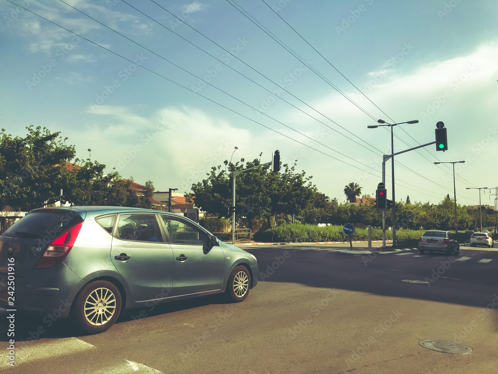 RISHON LE ZION, ISRAEL -APRIL 30, 2018: Cars on the road on a sunny day in Rishon Le Zion, Israel