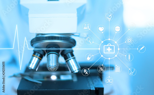 Photography doctor supervisor looking at the microscope slide in the forensic,Laboratory Med