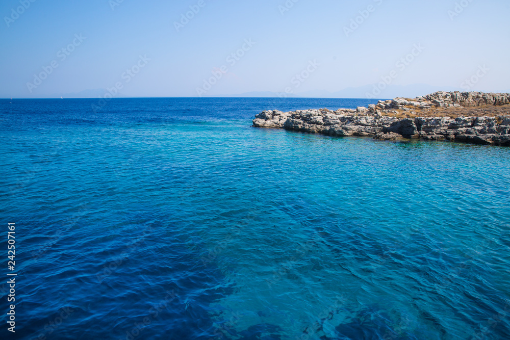 Crystal blue water near uninhabited little island. Crystal blue water near uninhabited little island.