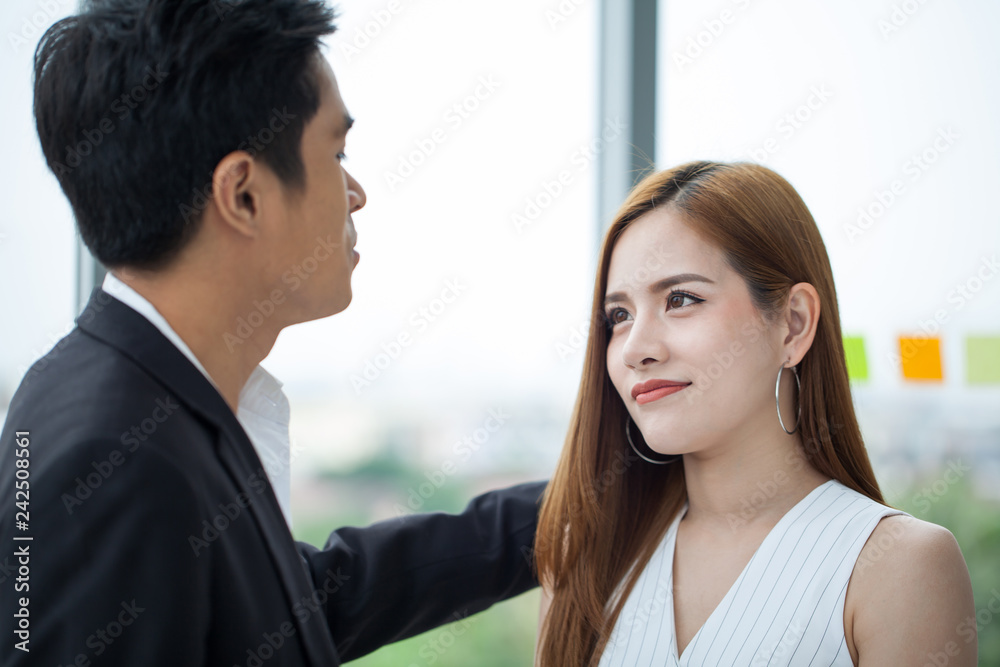 businessman patting businesswoman shoulder. mento supporting upset new girl worker colleagues . businessman patting businesswoman shoulder. mento supporting upset new girl worker colleagues .