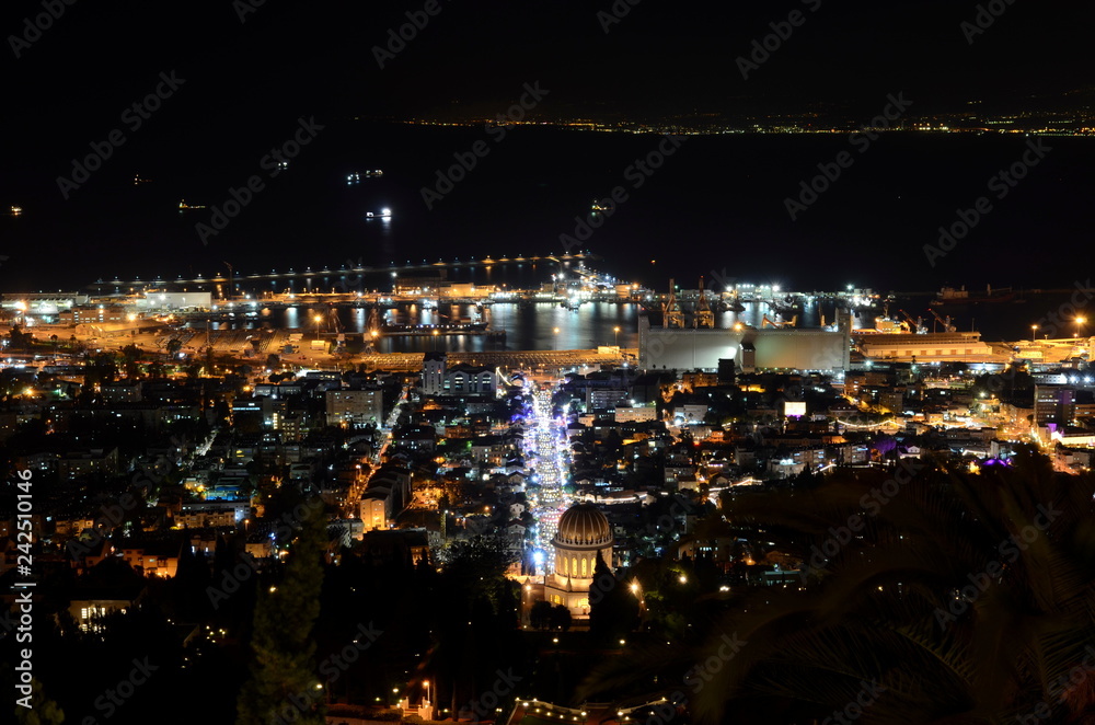 Naklejka premium Port of Haifa and Bahai Gardens by night