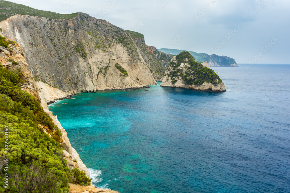 Greece, Zakynthos, Impressive cliffs at azure waters surrounding plakaki island