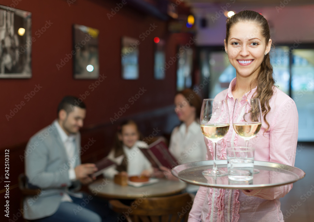 Waitress serving family of three