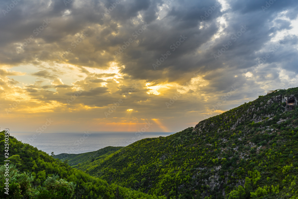 Obraz premium Greece, Zakynthos, Magic sunset sky and green valley to the ocean