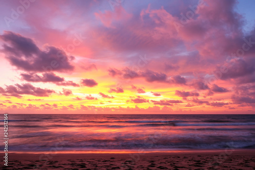 Beautiful sunset  with long exposure effect, motion blurred at Nai Yang Beach, Phuket, Thailand.