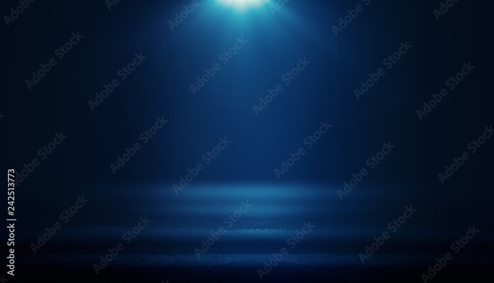 Background of empty dark room with rays of light. Concrete floor with light reflection. Smoke, neon blue light