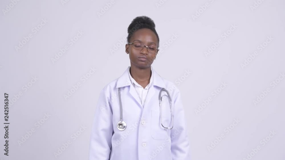 Young African woman doctor looking bored and tired Young African woman doctor looking bored and tired